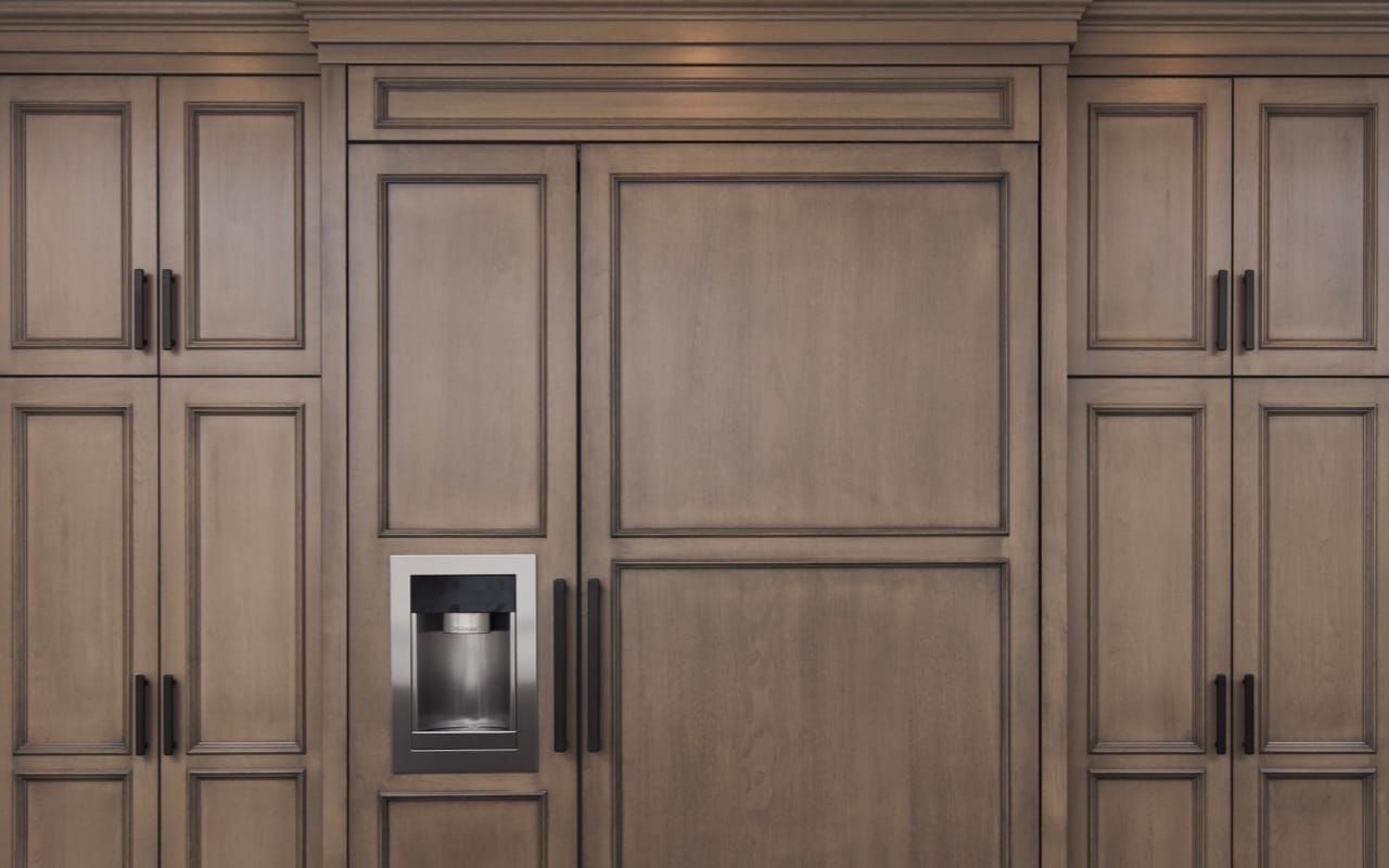 Paneled refrigerator with shaker-style detailing.