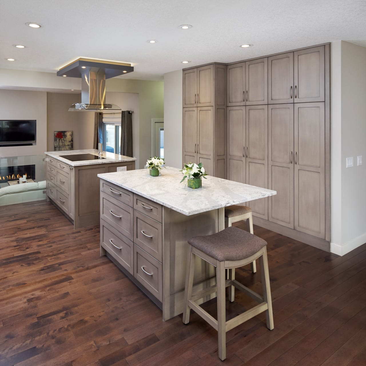 Tall wall-to-wall cabinetry in a warm neutral shade provide endless storage opportunities.