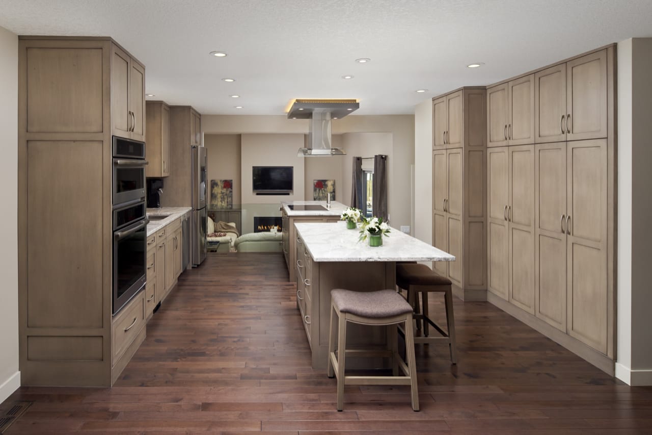 Floor to ceiling cabinets line both sides of this renovated kitchen.