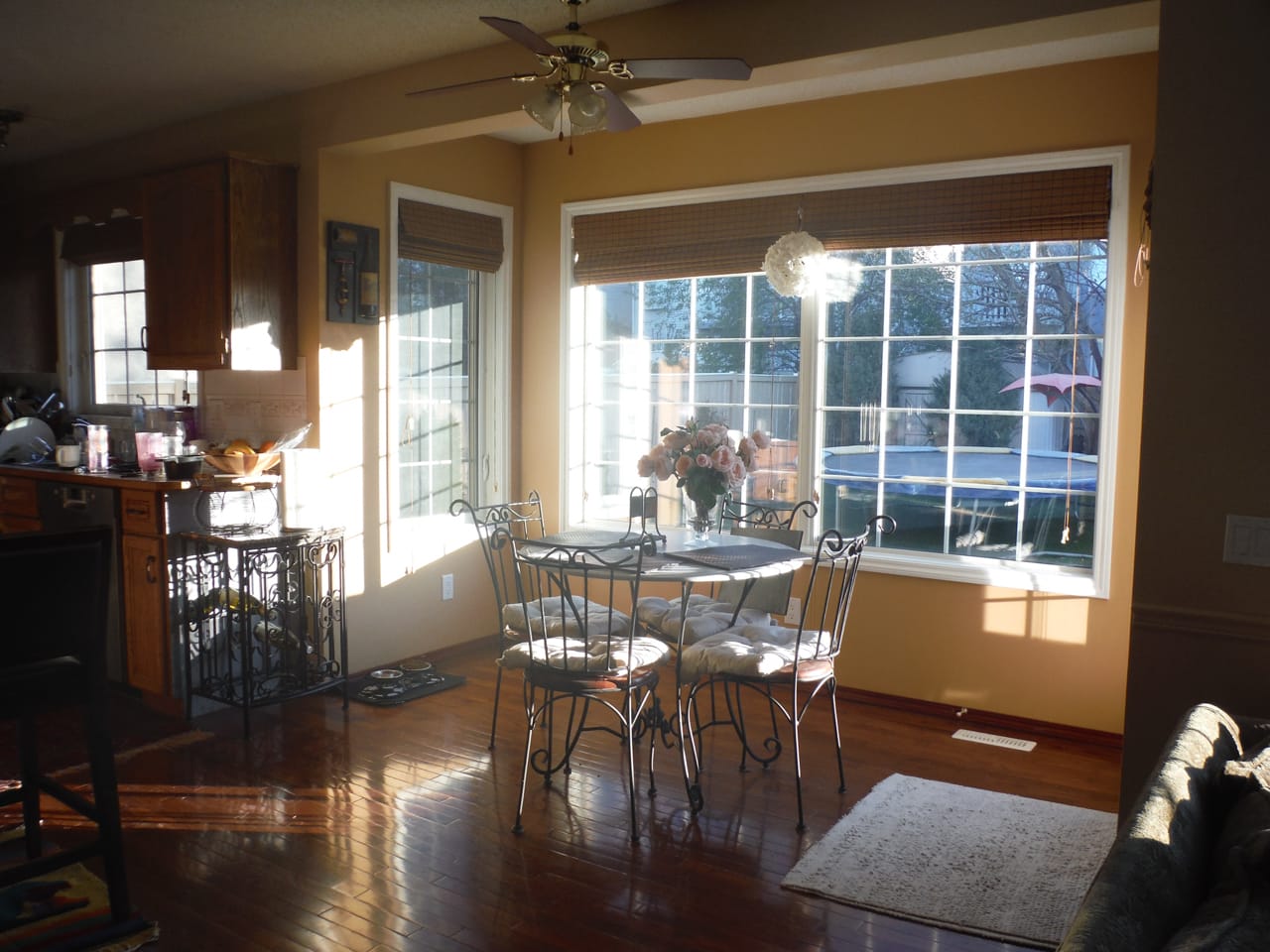 Dark and dated breakfast breakfast nook with small dining table.