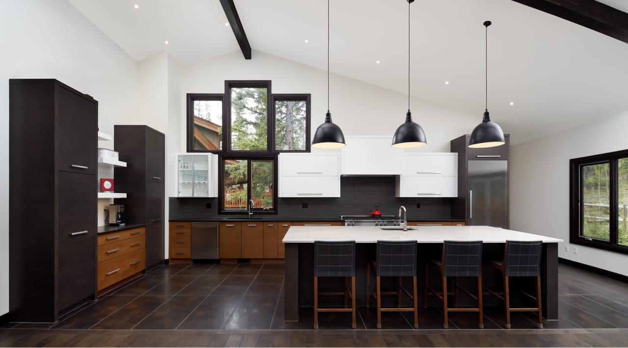 A spacious open concept kitchen with improved storage space and seating.