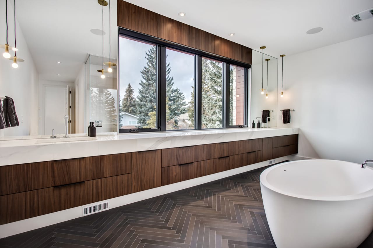 Contemporary bathroom with sleek walnut floating vanity.