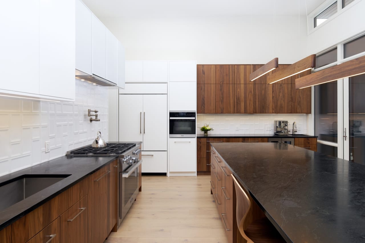 The oversized kitchen island with seating makes this kitchen the perfect hosting space.