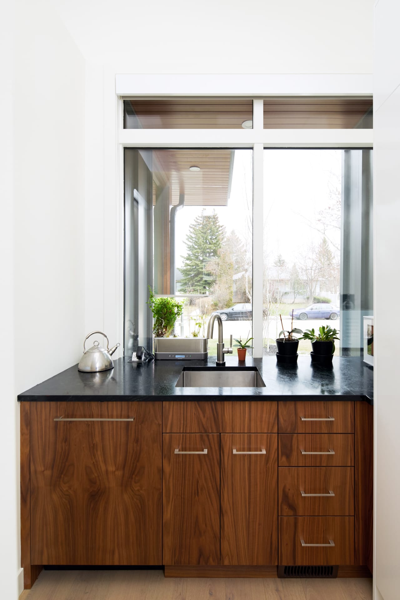 The butler's pantry with a seperate sink and dishwasher keep this kitchen organized.