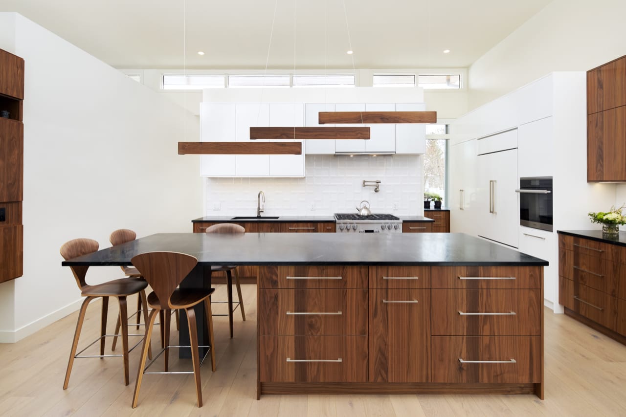 Slab-style cabinetry shines in this Contemporary kitchen design.